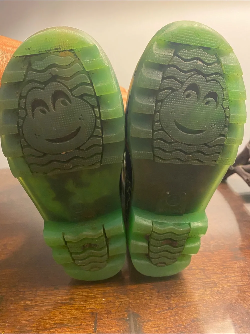 Western Chief Kids Black Rain Boots with Neon Green Handles and Accent Dinosaurs